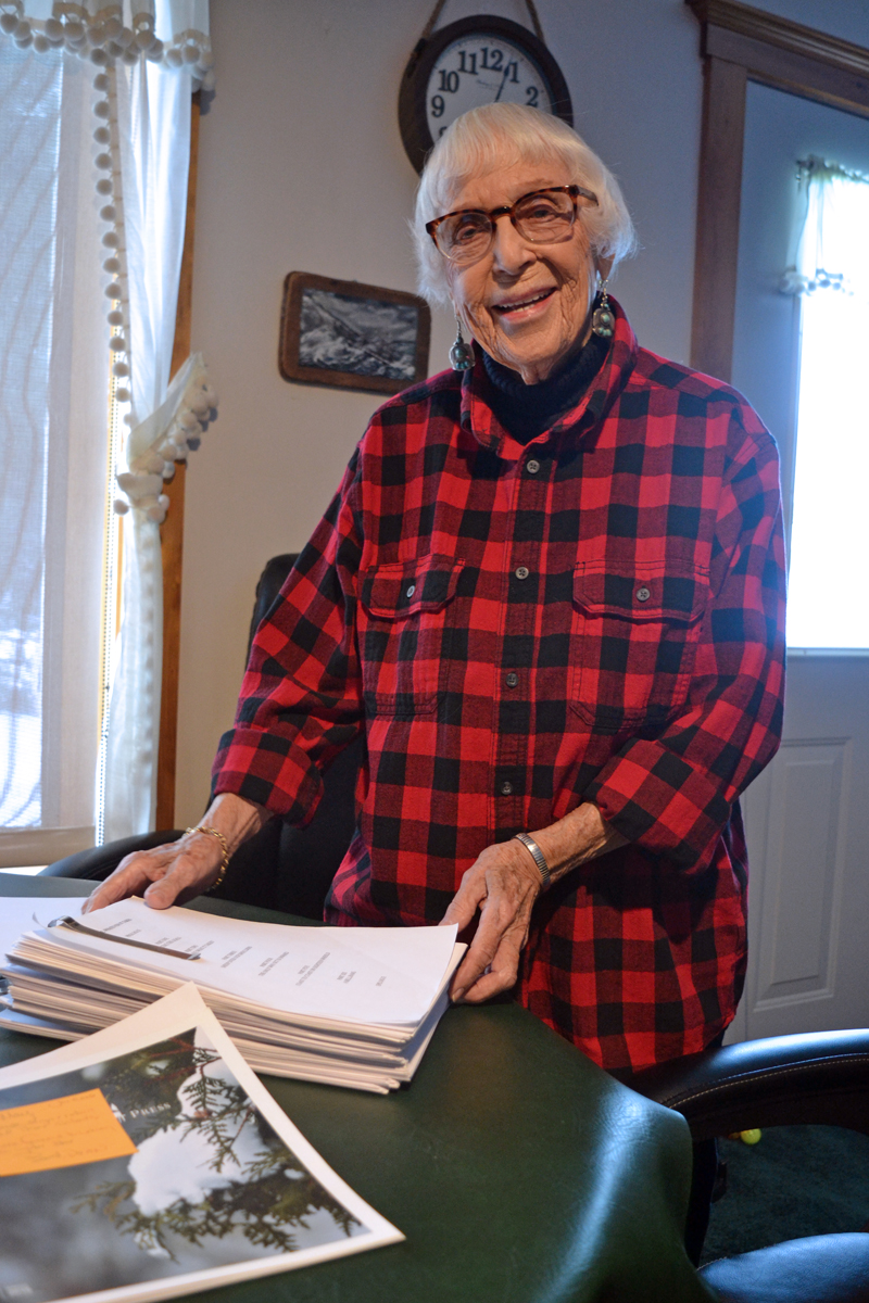 Whitefield author May Davidson with the 377-page manuscript for her forthcoming book, "Whatever It Takes," scheduled to be published in May by Islandport Press. (Christine LaPado-Breglia photo)