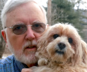 Organist Jay Zoller with a canine companion.