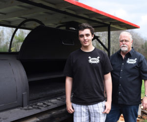 Wyatt Flower, 15, and his grandfather, Ken Flower, own Sweet Georgia BBQ. (Jessica Picard photo)