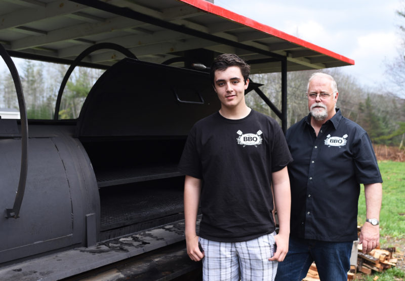 Wyatt Flower, 15, and his grandfather, Ken Flower, own Sweet Georgia BBQ. (Jessica Picard photo)