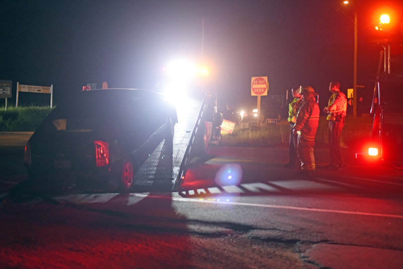 A Toyota Prius is placed on the back of a flatbed truck after a collision at the intersection of Routes 129 and 130 in Bristol on Thursday, May 31. (Jessica Picard photo)