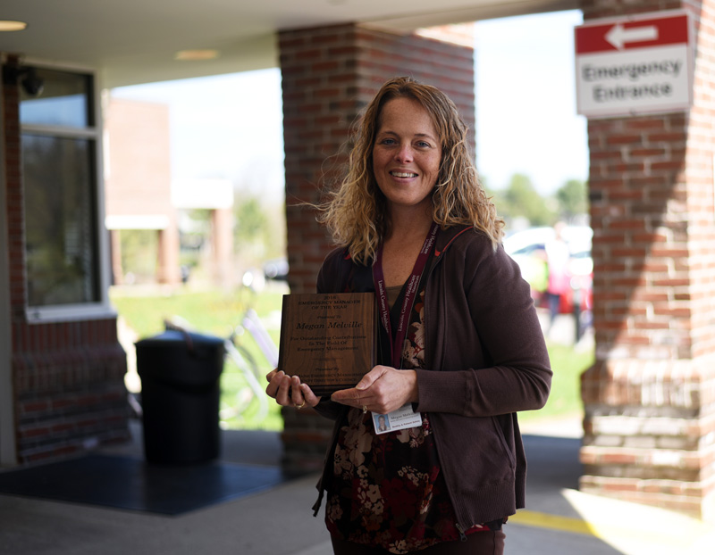 Megan Melville, LincolnHealth's safety specialist and emergency preparedness coordinator, stands in front of the hospital with her Oustanding Emergency Manager of the Year award Monday, May 7. (Jessica Picard photo)