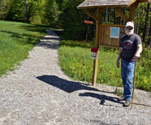 Lincoln County Historical Association Trustee David Probert stands at the kiosk of a new wheelchair-accessible trail on the grounds of the Pownalborough Courthouse in Dresden. (Greg Foster photo)
