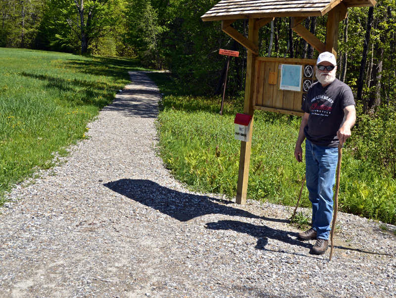 Lincoln County Historical Association Trustee David Probert stands at the kiosk of a new wheelchair-accessible trail on the grounds of the Pownalborough Courthouse in Dresden. (Greg Foster photo)