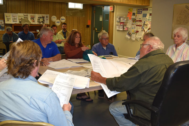 The Edgecomb Planning Board reviews blueprints for a pub on Route 27 during its meeting at the town hall Thursday, May 24. (Jessica Clifford photo)