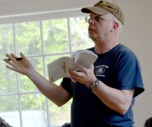 Edgecomb Fire Chief Roy Potter asks a question during the annual town meeting Saturday, May 19. (Maia Zewert photo)