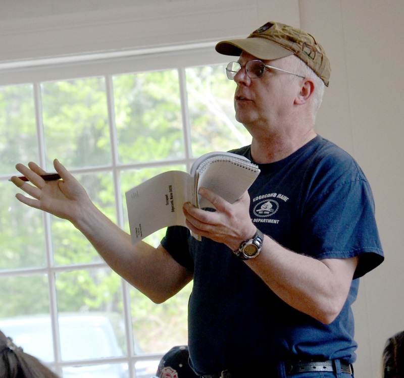 Edgecomb Fire Chief Roy Potter asks a question during the annual town meeting Saturday, May 19. (Maia Zewert photo)