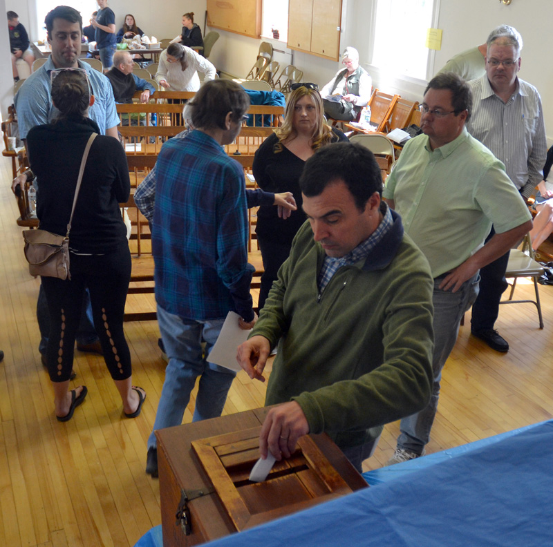 Edgecomb School Committee Chair Tom Abello casts his ballot during the annual town meeting at the town hall Saturday, May 19. (Maia Zewert photo)