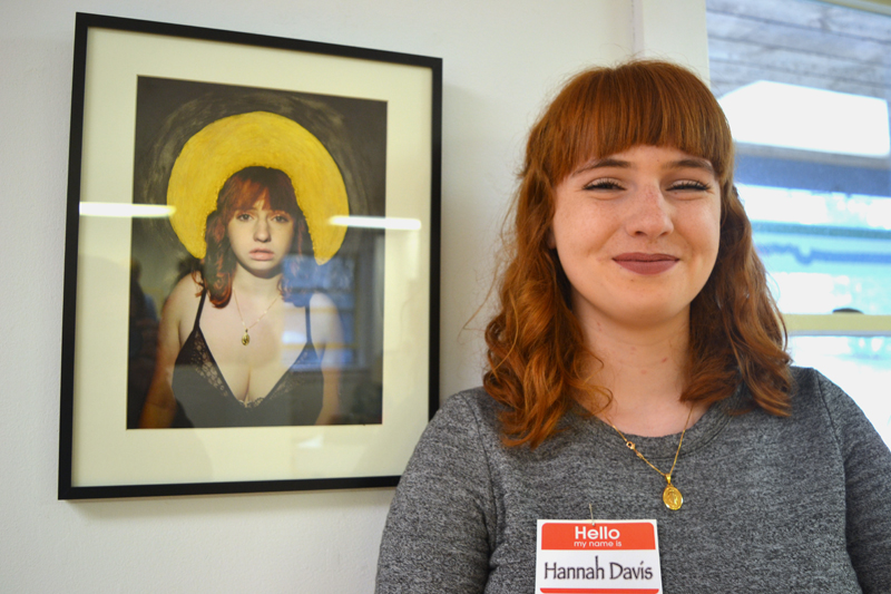 Lincoln Academy senior Hannah Davis stands alongside her self-portrait, "Mary," a digital photograph enhanced with acrylic paint, at the closing reception for the LA Student Art Show at River Arts. (Christine LaPado-Breglia photo)