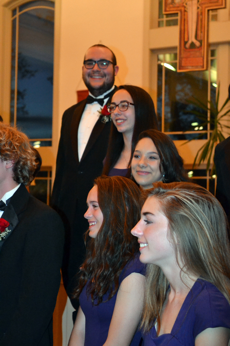 Graduating Lincoln Academy senior Miles Jackson (rear) basks in the glow of a successful choir concert and two awards at the end of the LA Spring Concert at St. Patrick's Catholic Church in Newcastle on Sunday, May 20. (Christine LaPado-Breglia photo)