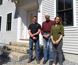From left: builder Paul Garber, Dr. Robert DeWitt Jr., and architect Anna Newbert stand in front of the new building at 50 Main St. in Newcastle on Tuesday, May 29. (Jessica Picard photo)
