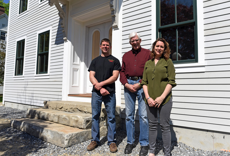 From left: builder Paul Garber, Dr. Robert DeWitt Jr., and architect Anna Newbert stand in front of the new building at 50 Main St. in Newcastle on Tuesday, May 29. (Jessica Picard photo)