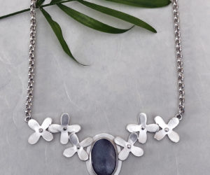 A silver-flower moonstone necklace chain by Christine Peters.