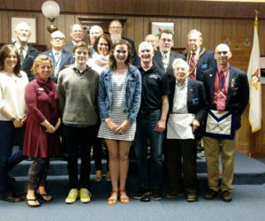 Central Lincoln County YMCA Program and Community Outreach Coordinator Karen-Ann Hagar (front row, second from left) joins the families of Schuyler Farrell (front row, fourth from left) and Nolen Michael (front row, third from left).