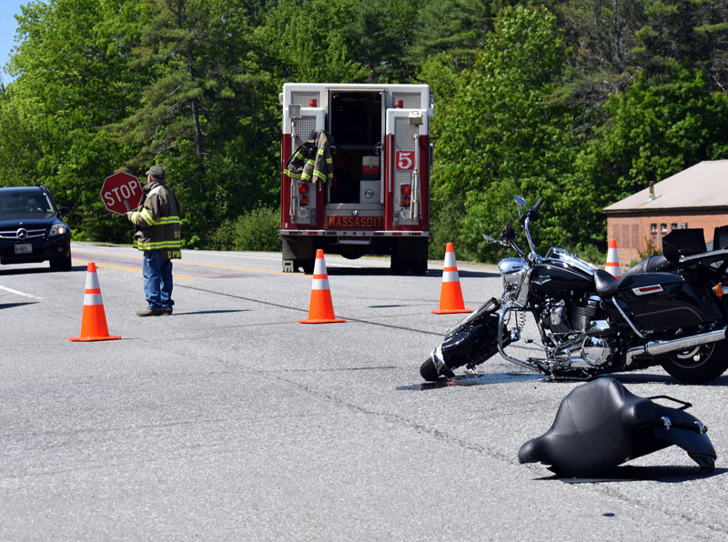 A firefighter directs traffic at the scene of a collision on Route 1 in Damariscotta the morning of Sunday, June 3. (Alexander Violo photo)