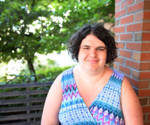 Quinn Gormley sits in front of Skidompha Library in Damariscotta on Wednesday, June 13. USA Today recently recognized Gormley for her work as executive director of the Maine Transgender Network. (Jessica Picard photo)