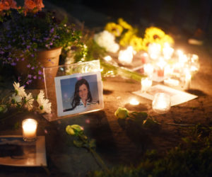 A photo of Isabelle Manahan is surrounded by candles and flowers during a vigil at Great Salt Bay Community School in Damariscotta on Monday, June 11. (Jessica Picard photo)