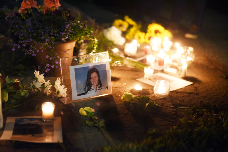 A photo of Isabelle Manahan is surrounded by candles and flowers during a vigil at Great Salt Bay Community School in Damariscotta on Monday, June 11. (Jessica Picard photo)