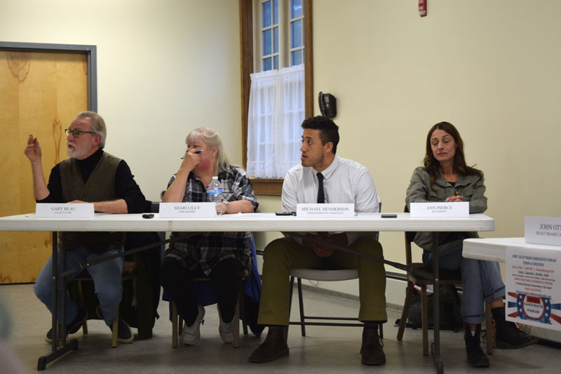 From left: moderator Gary Blau asks a question during the candidates forum at Pownalborough Hall in Dresden on Monday, June 4 as timekeeper Shari Lilly, Dresden Administrative Assistant Michael Henderson, and recorder Ann Pierce look on. (Jessica Clifford photo)