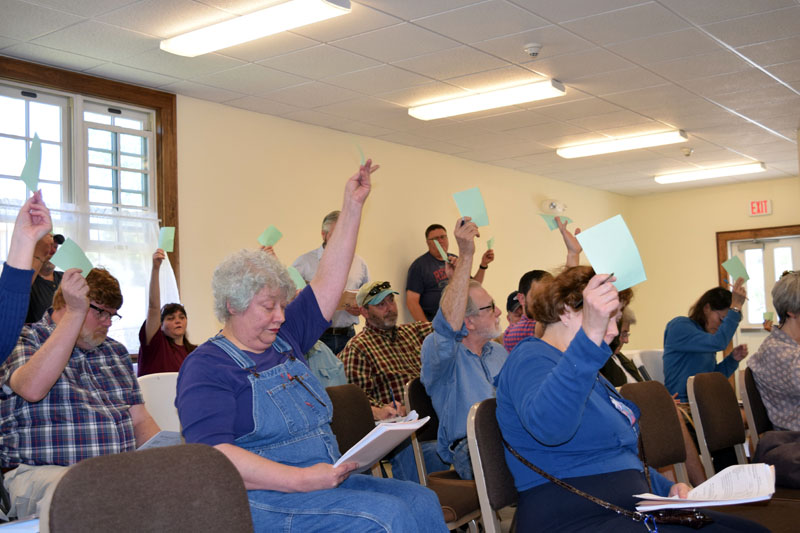 Dresden residents vote during the annual town meeting at Pownalborough Hall on Saturday, June 16. Voters approved all 37 articles, but amended seven. (Jessica Clifford photo)