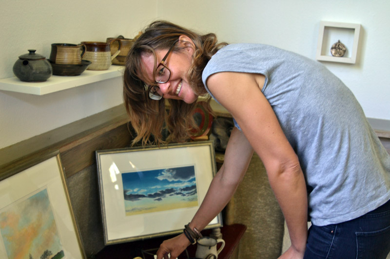 Potter Kila Bates arranges items at Edison Studio on Friday, June 22. (Christine LaPado-Breglia photo)