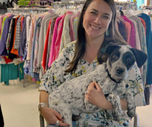 Consigning Women owner Annie Avantaggio and her dog, Patch, in the store at 521 Main St. in Damariscotta. In mid-September, Avantaggio will relocate the shop to 63 Main St. in Newcastle. (Maia Zewert photo)