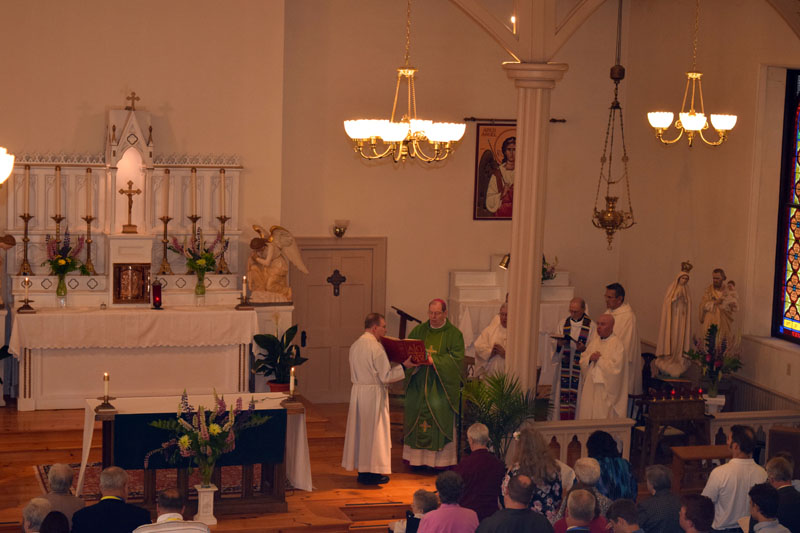 Bishop Robert P. Deeley (center, in green) participates in St. Denis Church's 200th anniversary Mass on Sunday, June 10. (Jessica Clifford photo)