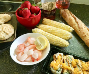 Mise en place for sauteed shrimp with lemon, mango sushi, crusty French bread, corn on the cob, and strawberry shortcake. Oh - and a Manhattan (duh). (Suzi Thayer photo)