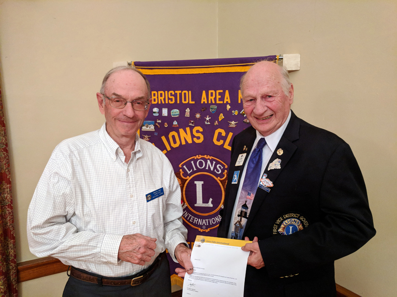 Bristol Area Lion Michael Hope (left) receives a 35-year chevron from Maine District Governor-Elect Neil Iverson. (Photo courtesy Tom Rodrigues)