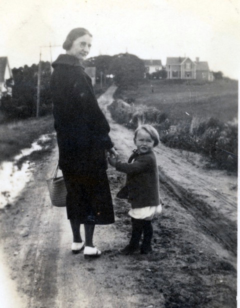A young Dan Thompson, with neighbor Grace Howard, walks down Southside Road in New Harbor toward home, ca. 1920. (Photo courtesy Merle Thompson)