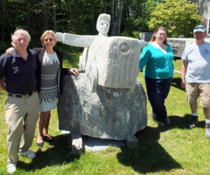From left: Bill Royall, Patricia Royall, Margaret Hoffman, and Dick Alden with Bill Royall's sculpture, "Soapbox Racer." (Photo courtesy Patricia Royall)