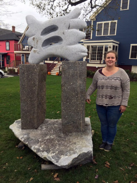 Isabel Kelley with her sculpture, "Reservations," at McKown Square. (Photo courtesy Patricia Royall)