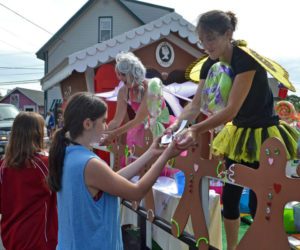 April Morrison (left) and Jessica Yates pass out cookies from the SugarSpell Sweets float during the 2017 Olde Bristol Days parade. The organizers of this year's Olde Bristol Days are in search of volunteers for the event. (LCN file photo)