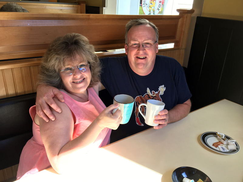 The Penalty Box owners Lisa and Kent Boucher share a cup of coffee during breakfast. Their Damariscotta restaurant now serves breakfast Saturday and Sunday. (Suzi Thayer photo)