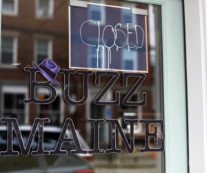 A closed sign on the door of Buzz Maine, at 133 Main St. in Damariscotta. The business closed Saturday, June 30, with the owner telling members she plans to reopen elsewhere next year. (Jessica Picard photo)
