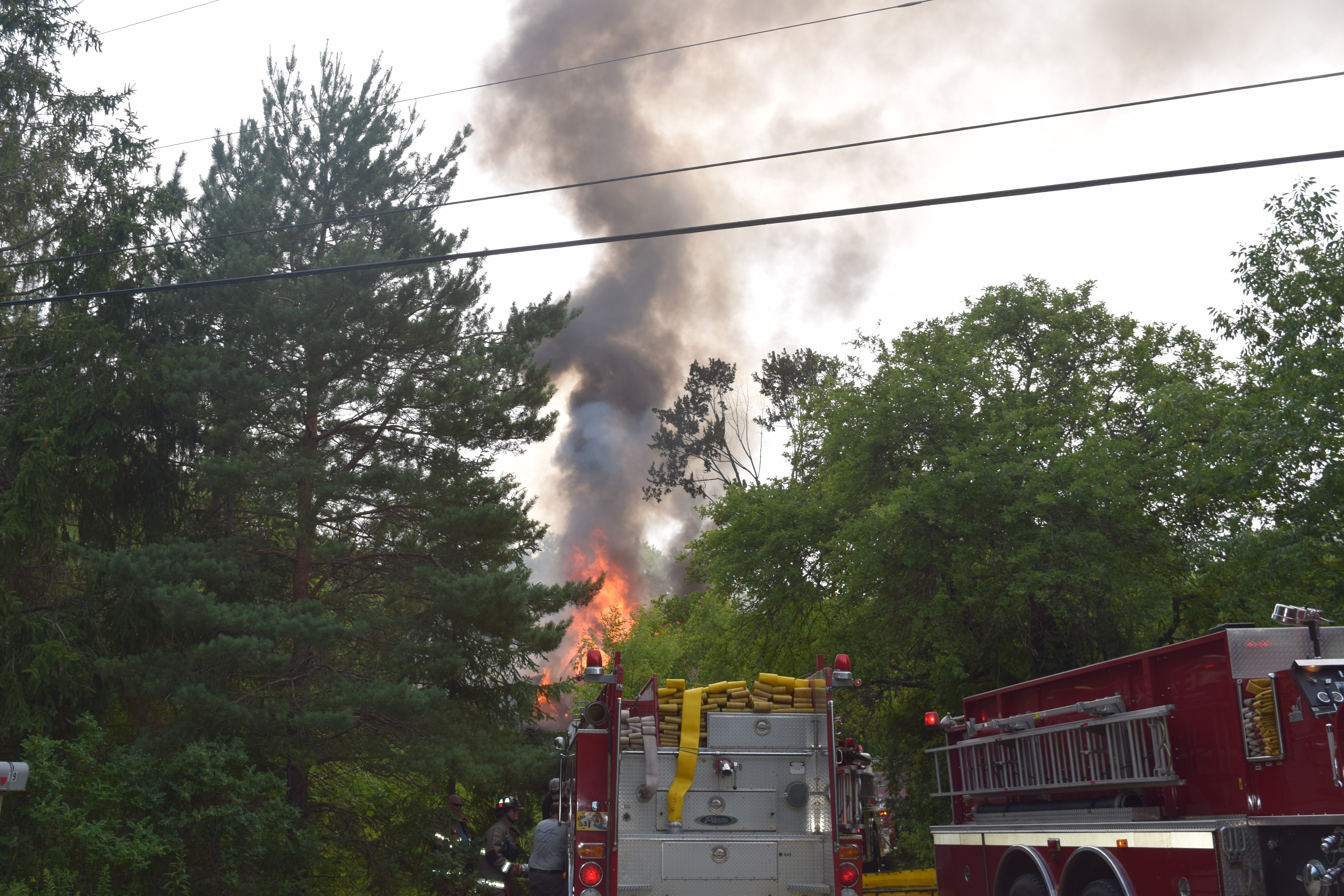 Flames and smoke rise from a house fire on Calls Hill Road in Dresden on Monday, July 16. (Jessica Clifford photo)