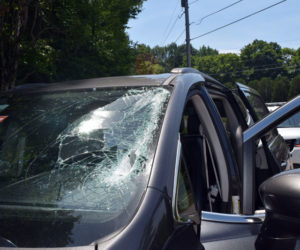 Four international student workers in a company vehicle were not hurt when a metal object from a passing truck went through the vehicle's windshield on Route 27 in Edgecomb the morning of Thursday, July 5. (Jessica Clifford photo)