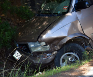 A GMC van came to rest in a ditch after a collision at the intersection of Route 1 and Route 27 in Edgecomb the afternoon of Saturday, July 7. One person was taken to a local hospital, according to a sheriff's deputy. (Alexander Violo photo)