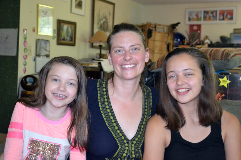 Elise Voigt relaxes at home on the afternoon of Friday, July 6 with two of her three daughters, Scarlet Pope (left) and Iris Pope (right). (Christine LaPado-Breglia photo)