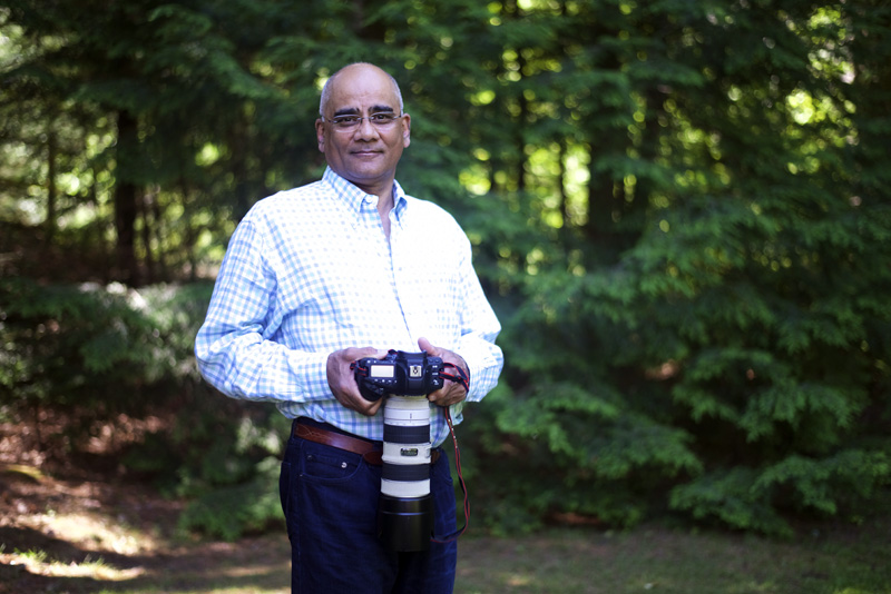 Dr. Rifat Zaidi poses with his camera in Newcastle, Thursday, July 5. (Jessica Picard photo)