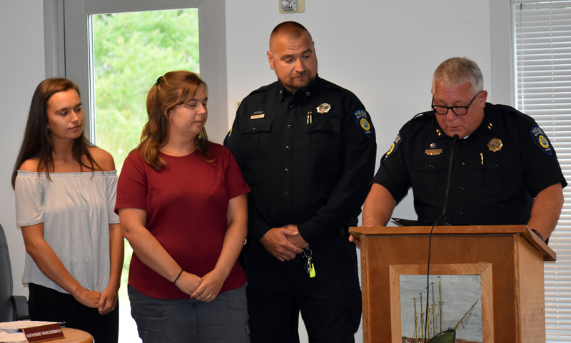 Officer Thomas Bartunek (second from right) stands with his wife and daughter and Police Chief William Labombarde during a medal ceremony at the Waldoboro municipal building Tuesday, July 24. (Alexander Violo photo)