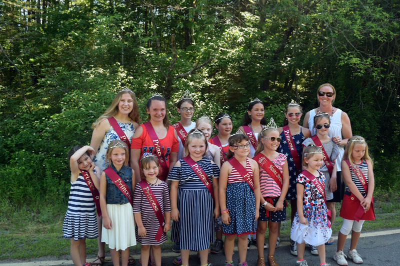 The Pittston Fair Maine Strawberry Pageant participants, with Pageant Director Liz Chaisson (back right), pose for a photo before walking in the Whitefield Fourth of July parade. (Jessica Clifford photo)