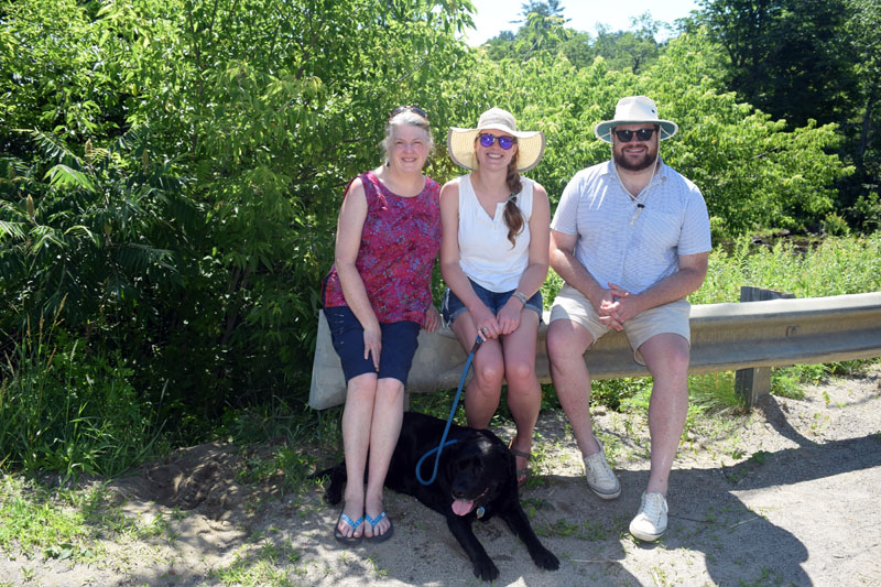 From left: Marion Mundy, Sarah Evans, and Ted Cooke attend the Whitefield Fourth of July parade for the first time with their English Lab, Odin. (Jessica Clifford photo)