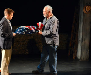 Michael Covel (left) and Peter Henderson fold the flag in "Independence Day," one of 14 vignettes in Heartwood Regional Theater Company's "Down Along the Cove." (Photo courtesy Jenny Mayher)