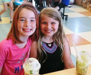 Local children enjoy salads from free summer meals program.