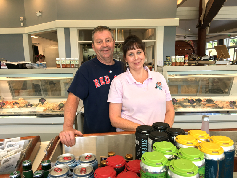 Russ and Cathy Pinkham at the oyster bar of their new store in Boothbay Harbor, Pinkham's Gourmet Market. (Suzi Thayer photo)