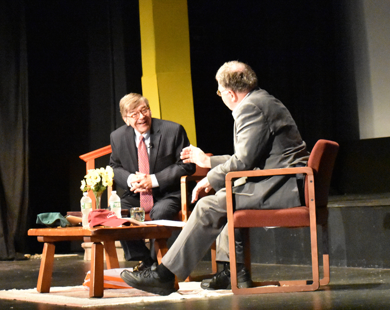 From left: Charles E. Cook Jr., editor and publisher of The Cook Political Report, speaks with Don Carrigan, a reporter with News Center Maine, at the Lincoln Theater in Damariscotta on Thursday, July 26. (Alexander Violo photo)