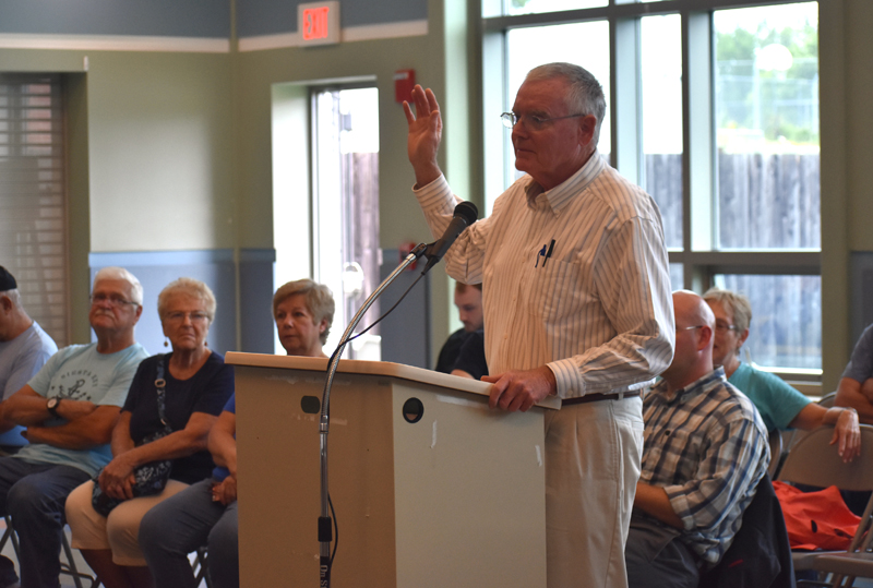 Tom Prouty is sworn in during the Dyer Long Pond water-level hearing at Jefferson Village School on Thursday, July 26. Prouty served as the representative for the petitioners. (Alexander Violo photo)