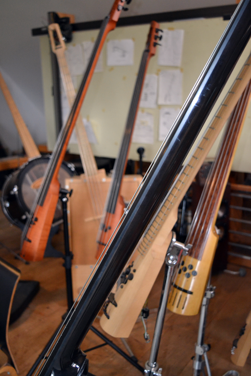 A profusion of basses in the loft area above Ned Steinberger's Nobleboro workshop. (Christine LaPado-Breglia photo)