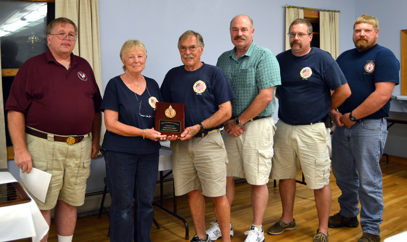 Lincoln County Fire Chiefs Association President Walter Morris (far left) presents the President's Award to the Pendleton family: Jeri, Ron, Scott, Jared, and Brad.